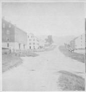 SA0297 - Photo of several buildings, including an office and infirmary on the left and an old dwelling house on the right. Identified on the back.